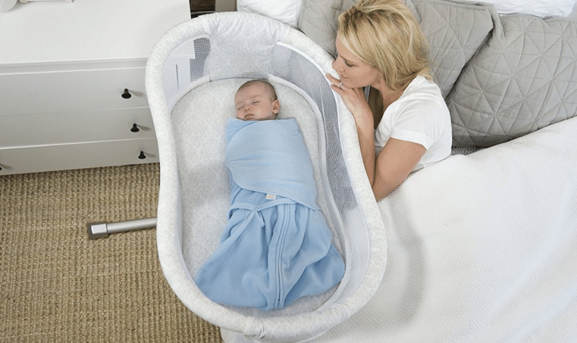 mother watching baby in halo esentia bassinet